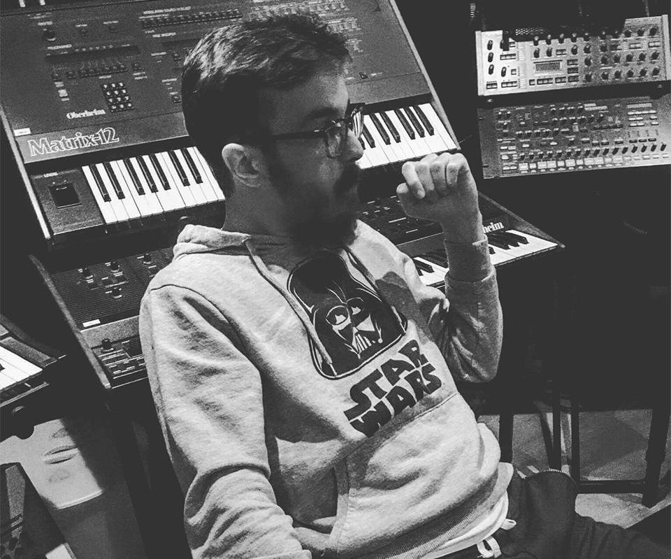 Music studio with synths in the background